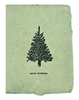 Christmas card with black evergreen tree and “merry christmas” on light green paper