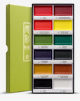 Japanese paint set with 12 color pans in metal tray, green cover visible