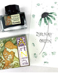 Ink bottle with Zsolnay Green label and art Nouveau card with green splash