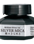 Silver Mica Japanese sumi ink bottle with black cap and label