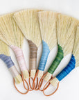 Set of wing brooms with mixed wrapped handles and tan tampico bristles
