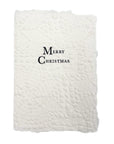 Christmas card with “Merry Christmas” text embossed on white quilted paper