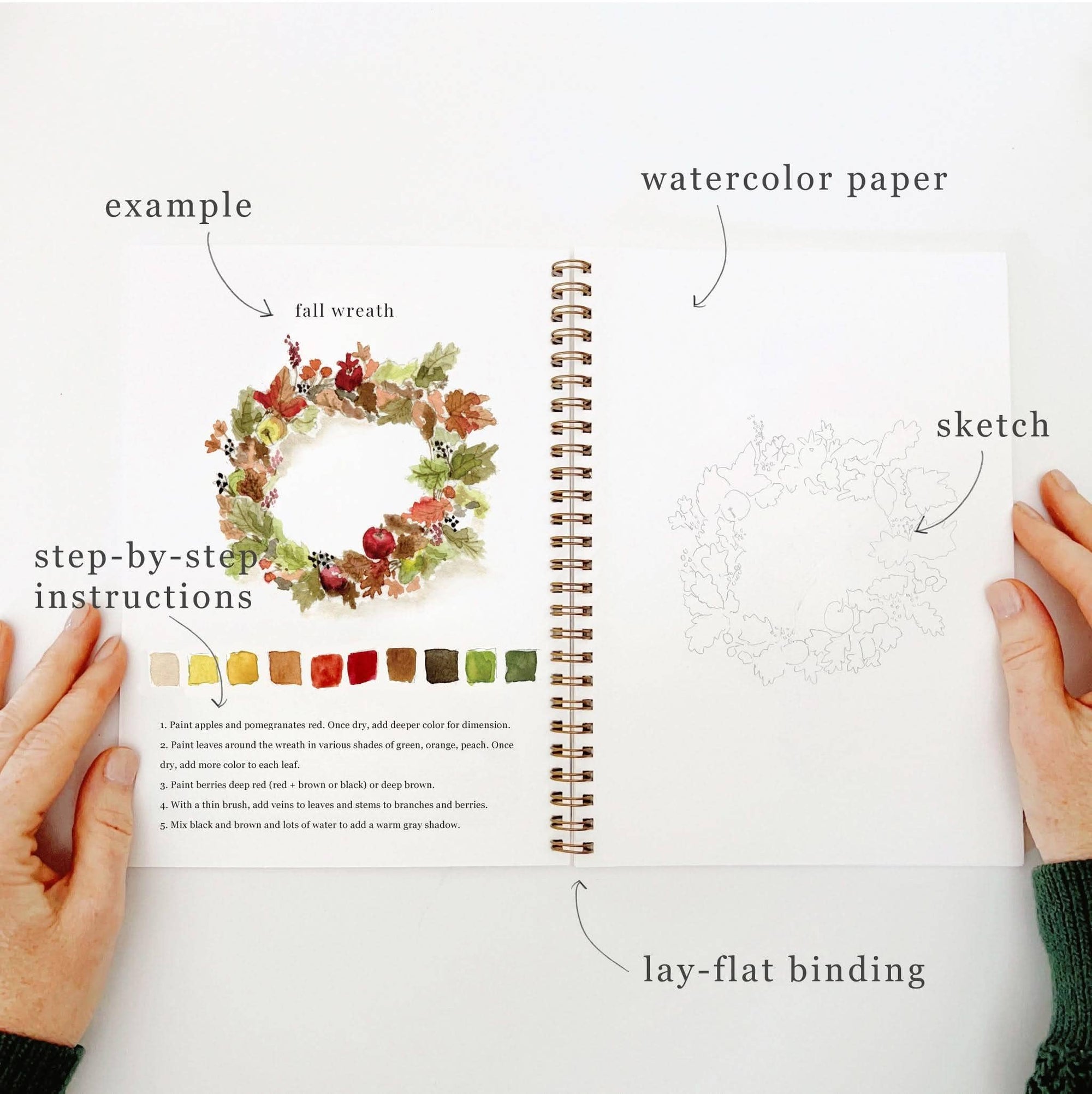 Autumn watercolor workbook open pages showing watercolor paper, sketch, and lay-flat binding
