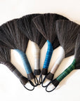 Tampico wing brush with dark bristle fan and multicolor leather-cord loops