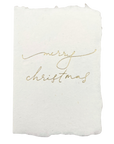 Christmas card with gold script “Merry Christmas” on white textured paper