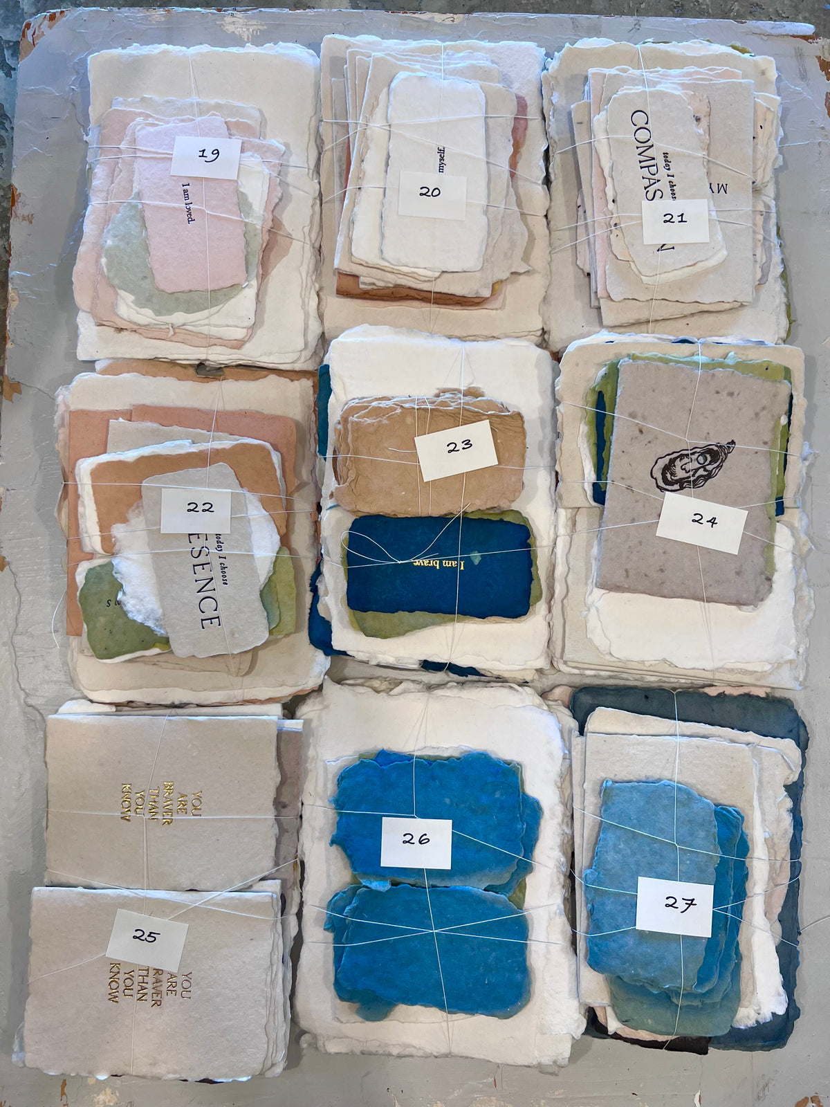 Assorted fabric scraps bundle with nine labeled fabric squares, mixed colors