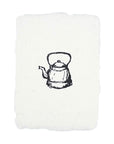 Holiday illustration card with black teapot illustration on off-white paper