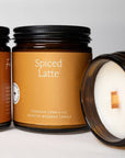 Spiced Latte beeswax jar candle jars with black lids and one open with wax visible