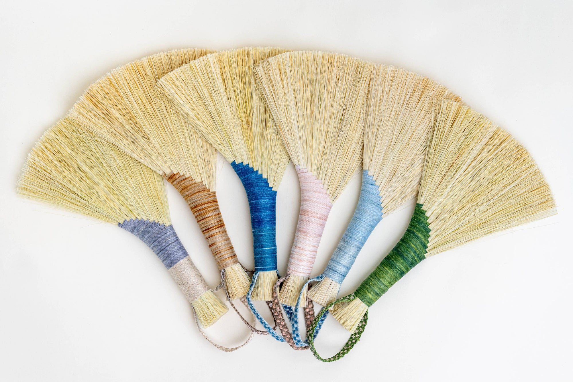 Tampico wing brush set with yellow bristle fans and multicolor handles with cords
