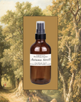 Amber glass room spray bottle with silver mist pump and fragrance label