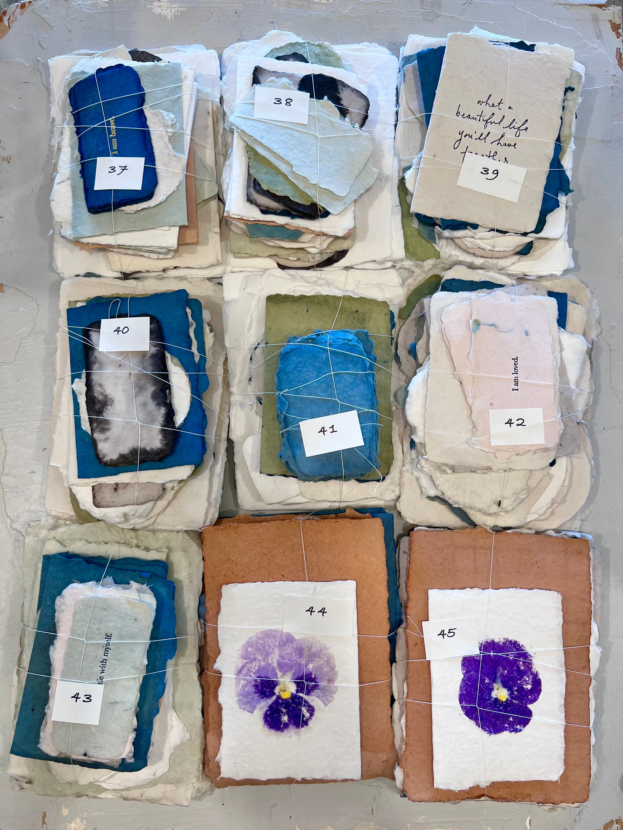 Assorted fabric bundle packs with numbered tags 37–45