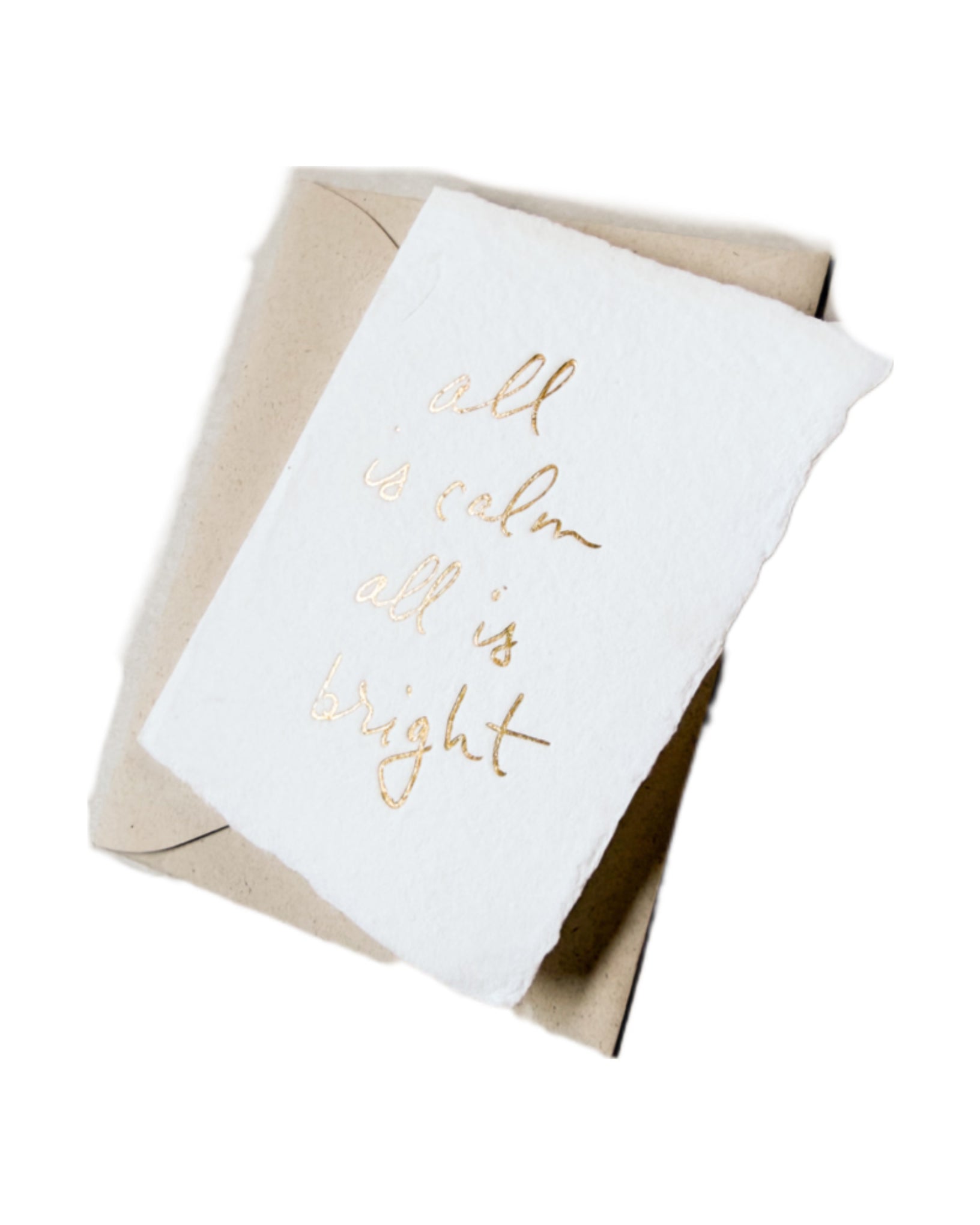 White Christmas card with gold script, tucked in kraft envelope