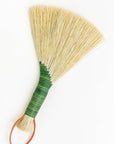 Green tampico wing brush with leather loop handle and striped wrap