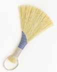 Tampico wing brush with yellow bristles, light blue wrap, and white braided cord loop